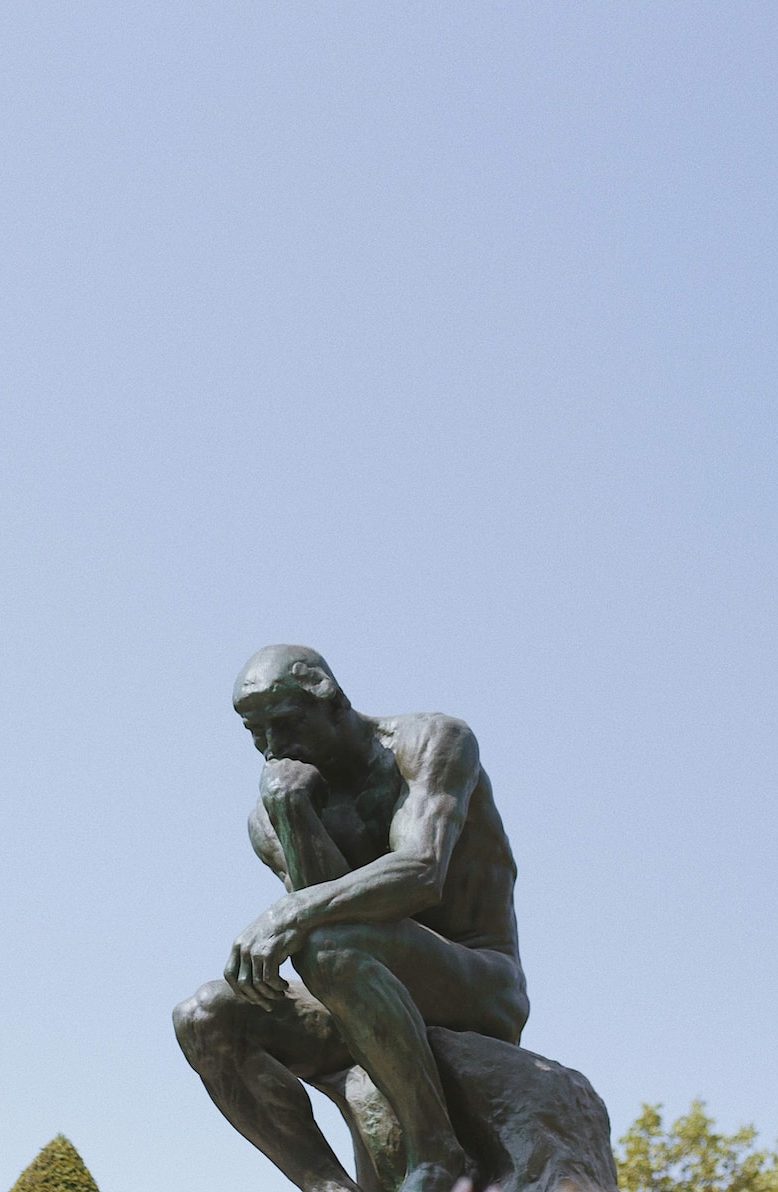 man sitting statue